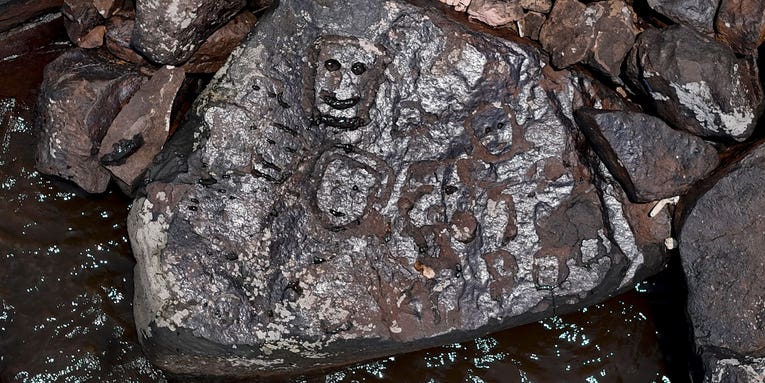 Drought reveals ancient rock carvings of human faces in Brazil