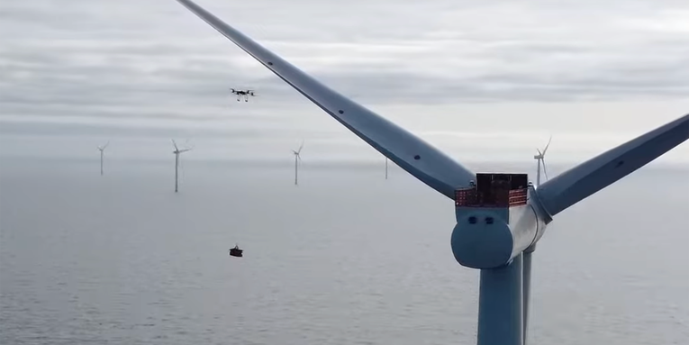 Watch a heavy-lifting drone land a perfect delivery on an offshore wind turbine